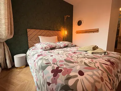 Un ou plusieurs lits dans un hébergement de l'établissement Les Chambres de David