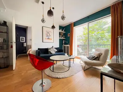 Coin salon dans l'établissement Superbe Appartement côté Jardin
