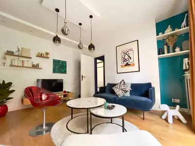 Coin salon dans l'établissement Superbe Appartement côté Jardin