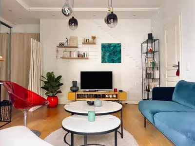 Télévision ou salle de divertissement dans l'établissement Superbe Appartement côté Jardin