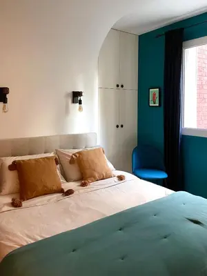 Un ou plusieurs lits dans un hébergement de l'établissement Superbe Appartement côté Jardin