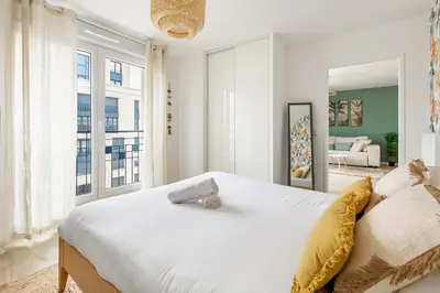 Un ou plusieurs lits dans un hébergement de l'établissement Refuge Naturel au Cœur des Docks by So Homy - 1 Bed Room 4 PAX