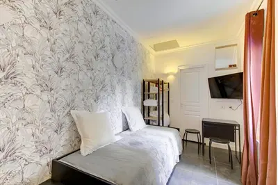Un ou plusieurs lits dans un hébergement de l'établissement Bluestay 187 - Charmant studio à Paris