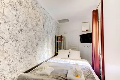 Un ou plusieurs lits dans un hébergement de l'établissement Bluestay 187 - Charmant studio à Paris