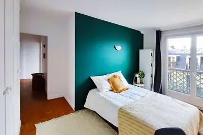 Un ou plusieurs lits dans un hébergement de l'établissement Flexliving - room - Villon