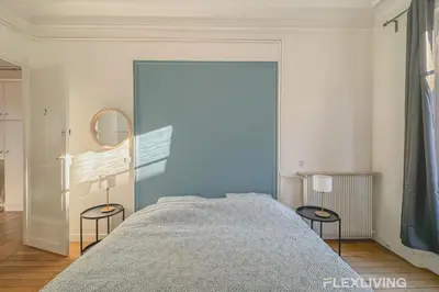 Un ou plusieurs lits dans un hébergement de l'établissement Flexliving - room - Felix Faure