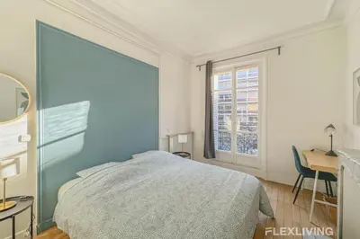 Un ou plusieurs lits dans un hébergement de l'établissement Flexliving - room - Felix Faure