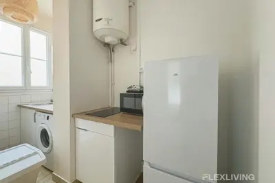 Cuisine ou kitchenette dans l'établissement Flexliving - Room - Mesnil