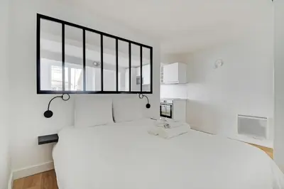 Un ou plusieurs lits dans un hébergement de l'établissement Flexliving - Studio - Saint Antoine