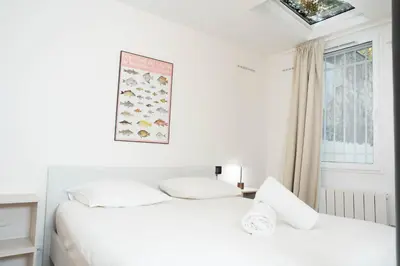 Un ou plusieurs lits dans un hébergement de l'établissement Loft Petion Dog friendly