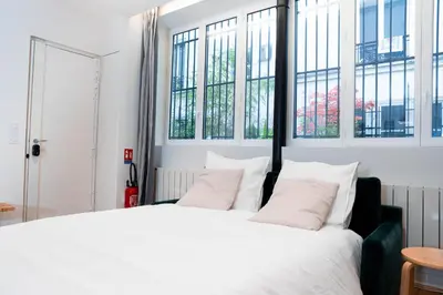 Un ou plusieurs lits dans un hébergement de l'établissement Loft Petion Dog friendly
