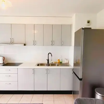 Cuisine ou kitchenette dans l'établissement Appartement Saint-Denis proche Stade de France