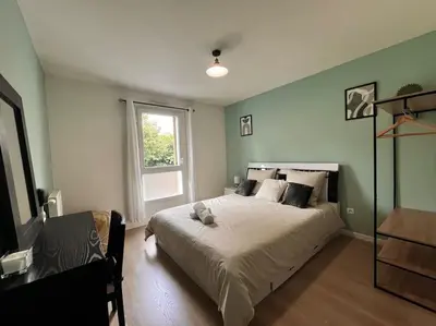 Un ou plusieurs lits dans un hébergement de l'établissement Appartement Saint-Denis proche Stade de France