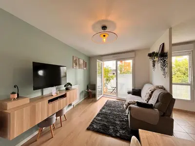 Télévision ou salle de divertissement dans l'établissement Appartement Saint-Denis proche Stade de France