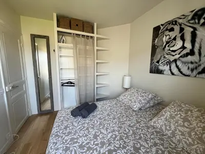 Un ou plusieurs lits dans un hébergement de l'établissement Magnifique appartement entièrement rénové