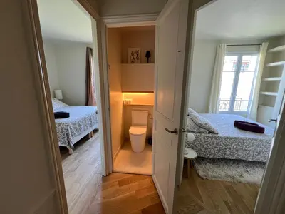 Un ou plusieurs lits dans un hébergement de l'établissement Magnifique appartement entièrement rénové