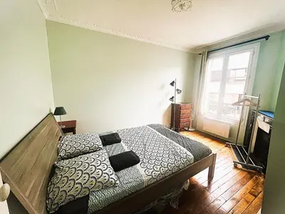 Un ou plusieurs lits dans un hébergement de l'établissement Magnifique appartement Paris