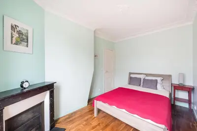 Un ou plusieurs lits dans un hébergement de l'établissement Magnifique appartement Paris