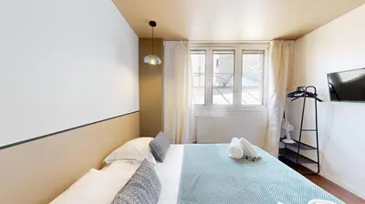 Un ou plusieurs lits dans un hébergement de l'établissement Bluestay 87 - Magnifique Appartement à Paris