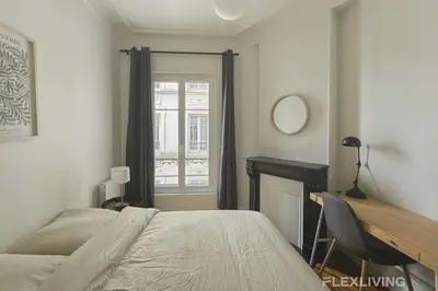 Un ou plusieurs lits dans un hébergement de l'établissement Cozy Room in Alésia Paris 14th