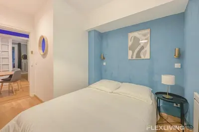 Un ou plusieurs lits dans un hébergement de l'établissement Flexliving - room - Neuilly-sur-Seine