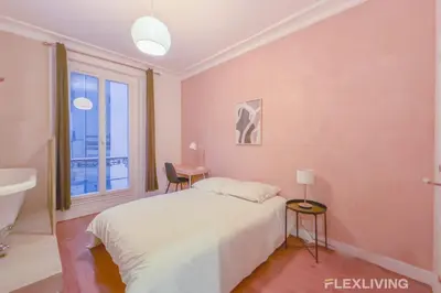 Un ou plusieurs lits dans un hébergement de l'établissement Flexliving - room - Neuilly-sur-Seine