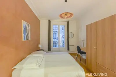 Un ou plusieurs lits dans un hébergement de l'établissement Flexliving - room - Neuilly-sur-Seine
