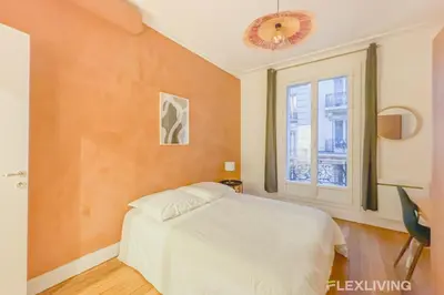 Un ou plusieurs lits dans un hébergement de l'établissement Flexliving - room - Neuilly-sur-Seine