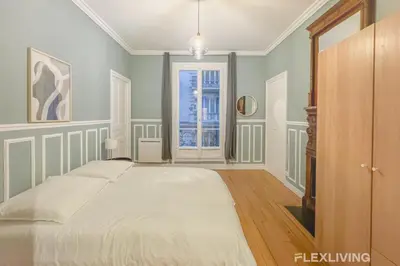 Un ou plusieurs lits dans un hébergement de l'établissement Flexliving - room - Neuilly-sur-Seine