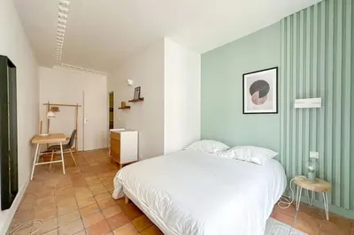 Un ou plusieurs lits dans un hébergement de l'établissement Flexliving - room - Echiquier