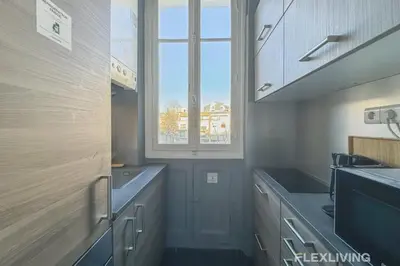 Cuisine ou kitchenette dans l'établissement Flexliving - room - Felix Faure