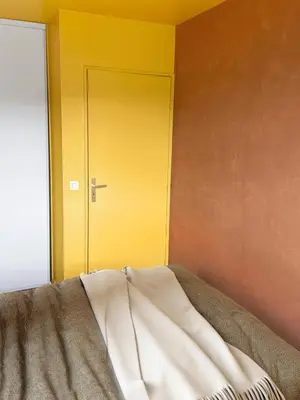 Un ou plusieurs lits dans un hébergement de l'établissement Confort et Style aux Portes de Paris