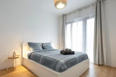 Un ou plusieurs lits dans un hébergement de l'établissement Appartement 3p proche du Stade de France