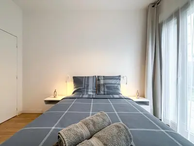 Un ou plusieurs lits dans un hébergement de l'établissement Appartement 3p proche du Stade de France