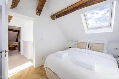 Un ou plusieurs lits dans un hébergement de l'établissement 3 bedrooms Sacrée cœur Place du Tertre Montmartre