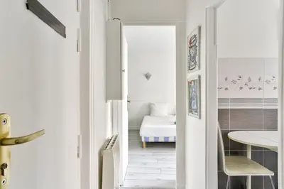 Un ou plusieurs lits dans un hébergement de l'établissement Charmant appartement proche du Canal de L'Ourcq