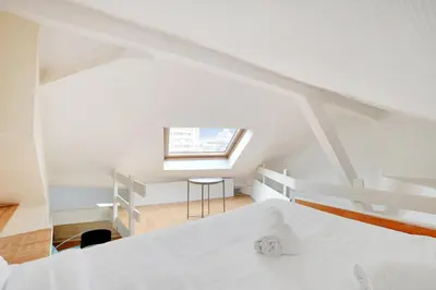 Un ou plusieurs lits dans un hébergement de l'établissement MALAKOFF - Cosy apartment L002