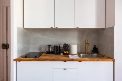 Cuisine ou kitchenette dans l'établissement The charming Republic Place