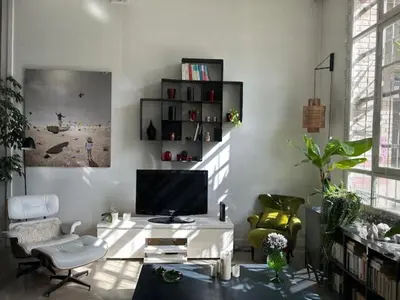 Coin salon dans l'établissement Appartement Loft centre ville