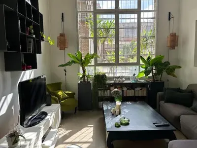 Coin salon dans l'établissement Appartement Loft centre ville