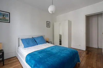 Un ou plusieurs lits dans un hébergement de l'établissement GuestReady - Beau Séjour près du Buttes-Chaumont