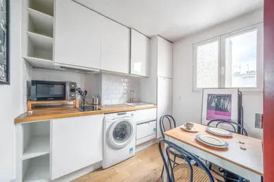 Cuisine ou kitchenette dans l'établissement Appartement confortable centre de Paris