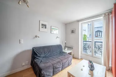 Coin salon dans l'établissement Appartement confortable centre de Paris