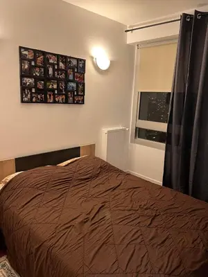 Un ou plusieurs lits dans un hébergement de l'établissement Big Appartement new courbevoie Defense