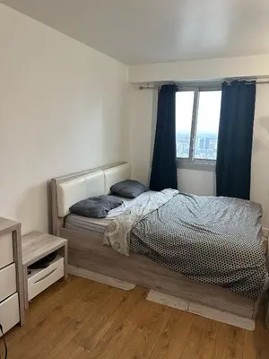 Un ou plusieurs lits dans un hébergement de l'établissement Big Appartement new courbevoie Defense