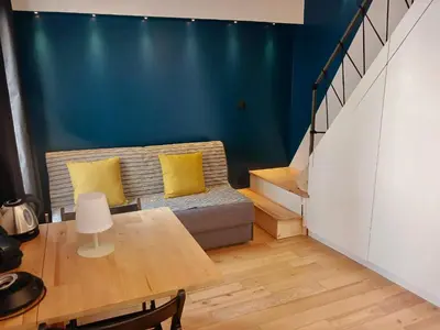 Coin salon dans l'établissement Très joli Studio - centre Paris - Le Coeur du Marais