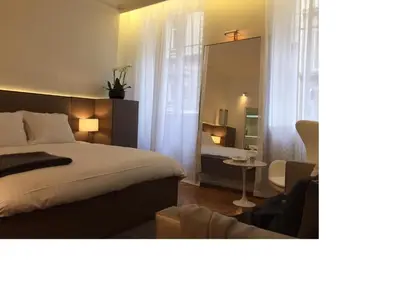 Un ou plusieurs lits dans un hébergement de l'établissement Cirque Deluxe Studio Apartment