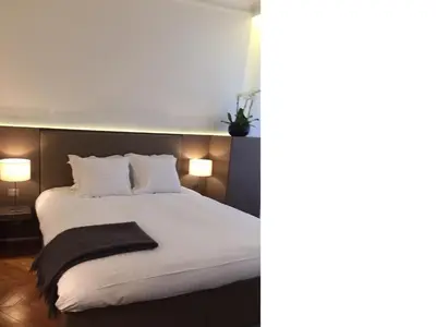 Un ou plusieurs lits dans un hébergement de l'établissement Cirque Deluxe Studio Apartment