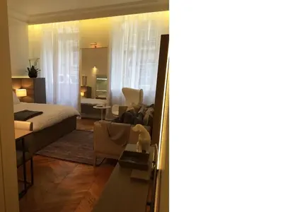 Un ou plusieurs lits dans un hébergement de l'établissement Cirque Deluxe Studio Apartment