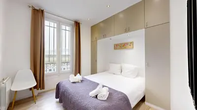 Un ou plusieurs lits dans un hébergement de l'établissement Bluestay 1 - Appartement au Cœur de Paris